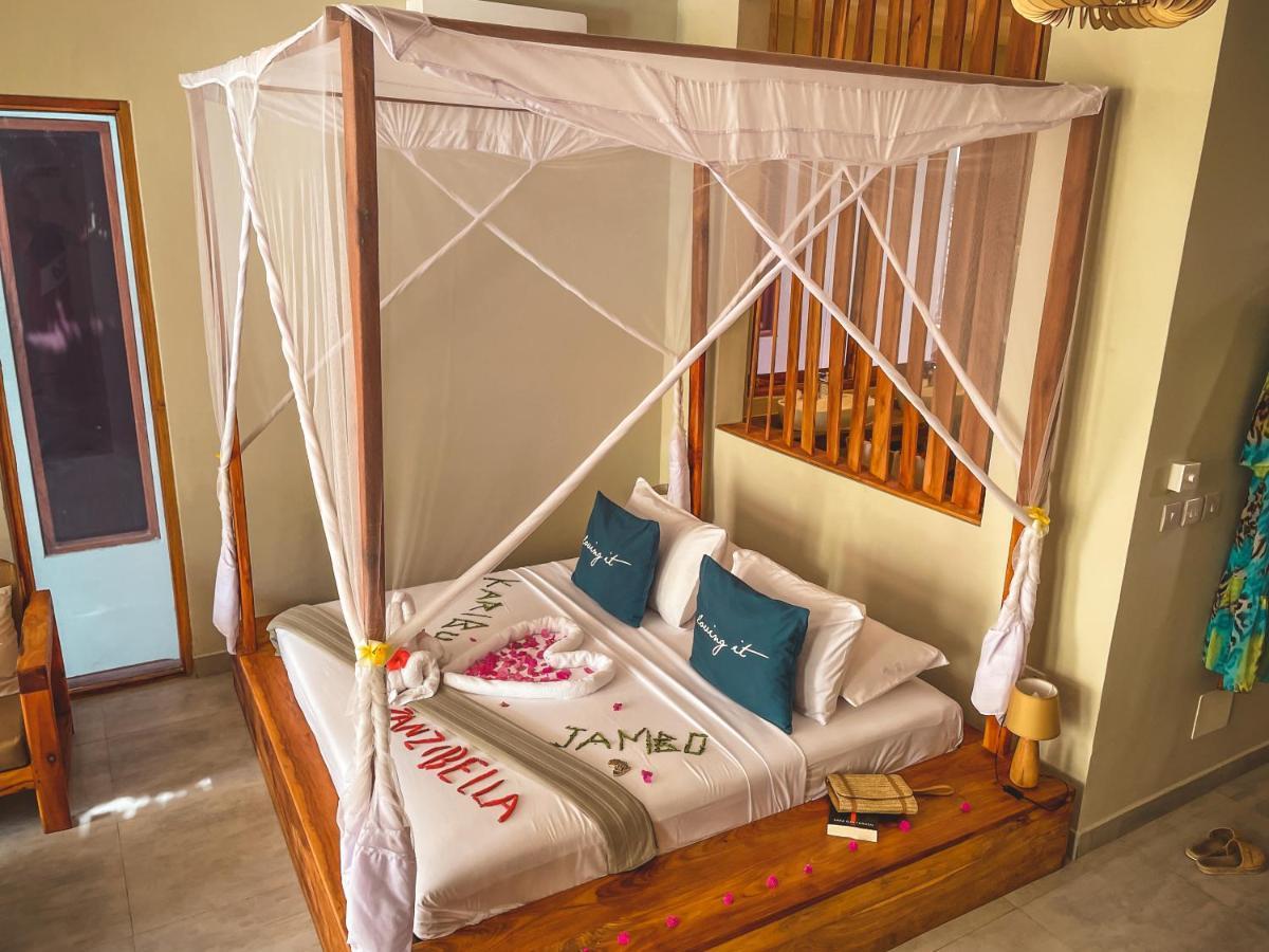 Zanzibella Hotel & Spa Kiwengwa (Zanzibar) Exterior foto A bed with a mosquito net